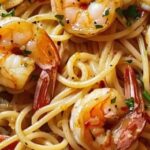 A delicious plate of Garlic Shrimp Pasta with fresh parsley and Parmesan.