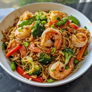 Close-up of a delicious high-protein shrimp stir-fry with noodles and vegetables.