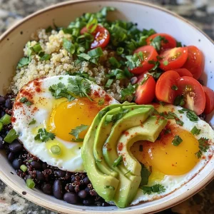 Delicious breakfast bowl packed with protein, including eggs, avocado slices, and black beans, presented in a rustic dish.