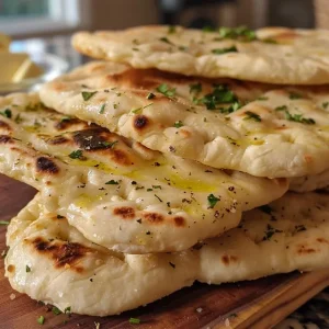Juicy yogurt flatbread displayed on a plate with light behind it.