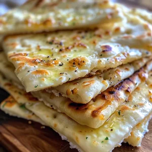 Juicy cottage cheese flatbreads arranged on a plate, highlighting their appealing color and shape.