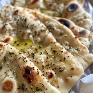 Juicy, inviting flatbread displayed on a clean kitchen countertop.