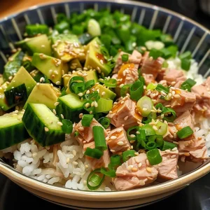 Juicy Tuna Rice Bowl with olive oil-packed tuna and fresh vegetables, shot on an iPhone.