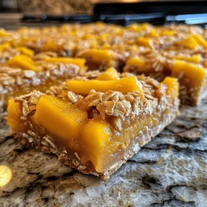 A delicious slice of mango oatmeal bars highlighting a juicy mango topping and oat crust.