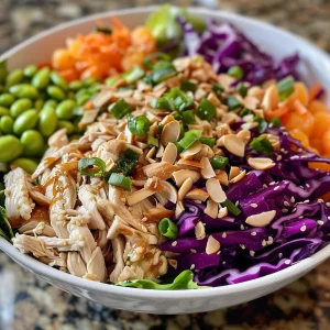 Close-up view of a vibrant Asian Chicken Salad with fresh ingredients.