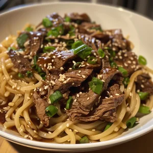 Close-up view of a delicious garlic beef noodle bowl with fresh herbs and sauces.