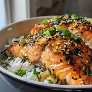 Close-up view of a Garlic Butter Salmon Rice Bowl with vibrant colors and textures.