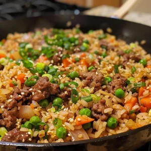 Close-up view of a colorful One-Pan Beef Teriyaki Rice Skillet with veggies.