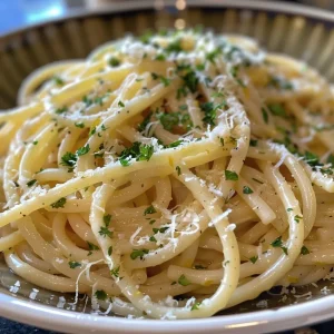 ['Close-up view of creamy lemon garlic pasta garnished with parsley.', 'Side view of a plate of spaghetti covered in creamy lemon sauce and grated Parmesan.', 'A delicious serving of creamy lemon garlic pasta with visible garlic and lemon zest.', 'Bowl of lemon garlic pasta with a rich creamy texture and fresh herbs.']