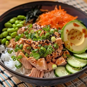 ['Close-up of a colorful Healthy Asian Tuna Bowl featuring tuna, edamame, and avocado.', 'Side view of a vibrant tuna bowl with sliced cucumber, scallions, and sesame seeds.', 'Healthy Asian Tuna Bowl filled with fresh ingredients like avocado and shredded carrot.', 'Bowl of prepared tuna with edamame, surrounded by lettuce and seaweed snacks.']