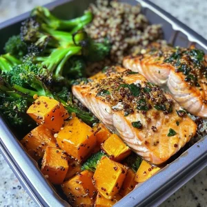 ['A vibrant Easy Salmon Meal Prep Bowl featuring salmon, quinoa, and colorful vegetables.', 'Close-up side view of a meal prep bowl filled with salmon, broccolini, sweet potatoes, and quinoa.', 'A healthy meal prep bowl with juicy salmon filets, roasted veggies, and a drizzle of lemon vinaigrette.', 'A delicious and colorful Easy Salmon Meal Prep Bowl showcasing various healthy ingredients.']